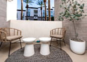 Thumbnail 58 of 85 - Two white toilets are in the middle of a patio.