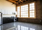 Thumbnail 7 of 20 - Unstaged kitchen/Dining/Living