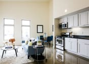 Thumbnail 8 of 12 - staged kitchen/living room