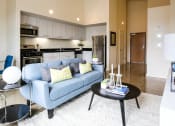 Thumbnail 3 of 12 - staged living room with view of kitchen