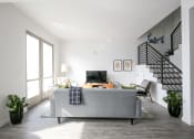 Thumbnail 3 of 19 - Staged Living Room with view form behind couch