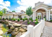 Thumbnail 49 of 49 - a home with a waterfall in the front yard