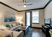 Thumbnail 51 of 54 - a living room with a couch and a coffee table