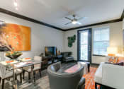 Thumbnail 49 of 54 - a living room and dining room with a couch and a table