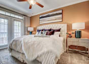 Thumbnail 36 of 40 - a bedroom with a bed and a ceiling fan
