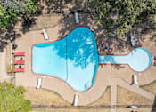 Thumbnail 5 of 17 - an aerial view of a swimming pool with trees and a courtyard