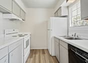 Thumbnail 8 of 17 - a kitchen with white appliances and white cabinets