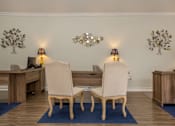 Thumbnail 12 of 42 - a dining room with two chairs and a table