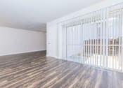 Thumbnail 34 of 42 - the living room of a house with wood floors and a white gate