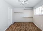Thumbnail 40 of 42 - a room with a carpet and a ceiling fan