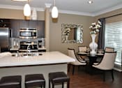 Thumbnail 33 of 40 - interior view of dining room table and bar area in kitchen