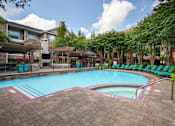 Thumbnail 5 of 40 - a swimming pool at the resort on a sunny day