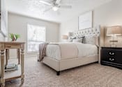 Thumbnail 29 of 37 - a white bedroom with a large bed and a night stand