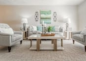 Thumbnail 16 of 37 - a living room with two couches and a table