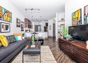 Thumbnail 45 of 48 - a living room with a couch and a tv