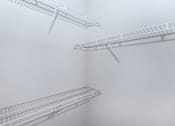 Thumbnail 43 of 48 - three white shelves on a wall in a foggy room