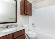 Thumbnail 31 of 48 - a bathroom with a sink toilet and bath tub