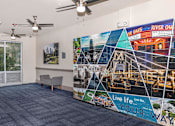 Thumbnail 15 of 48 - a lobby with a large mural on the wall