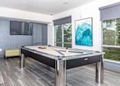 Thumbnail 5 of 48 - a games room with a pool table and a tv