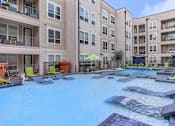 Thumbnail 3 of 48 - our apartments have a large swimming pool with lounge chairs
