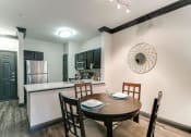 Thumbnail 53 of 54 - a dining room and kitchen with a table and chairs