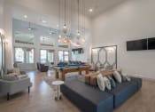 Thumbnail 21 of 54 - a living room with a blue couch and a pool table