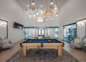 Thumbnail 18 of 54 - a pool table in the middle of a living room