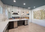 Thumbnail 34 of 54 - an open kitchen and living room with a counter top