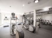 Thumbnail 29 of 54 - a gym with weights and other exercise equipment