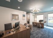 Thumbnail 14 of 54 - a conference room with a desk and chairs