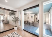 Thumbnail 23 of 54 - a living room with a large mirror and a rug