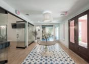 Thumbnail 19 of 54 - a lobby with a round table and a blue and white rug