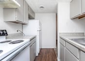 Thumbnail 35 of 43 - a kitchen with white appliances and white cabinets