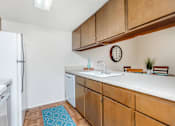 Thumbnail 23 of 43 - a kitchen with wooden cabinets and a white refrigerator