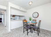 Thumbnail 24 of 43 - a dining room table with a large clock on the wall
