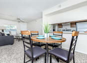 Thumbnail 25 of 43 - A dining room with a round table and chairs.
