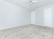 Thumbnail 40 of 43 - an empty room with a ceiling fan and white walls