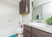 Thumbnail 30 of 43 - a bathroom with a sink toilet and a mirror