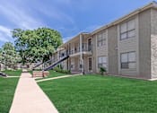 Thumbnail 4 of 43 - our apartments feature a spacious courtyard with green grass