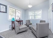 Thumbnail 5 of 43 - a living room with couches and chairs and a table