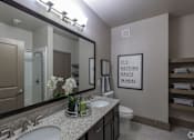 Thumbnail 44 of 48 - a bathroom with two sinks and a large mirror