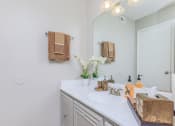 Thumbnail 47 of 54 - a bathroom with a sink and a mirror
