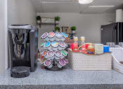 Thumbnail 16 of 54 - a coffee maker and a basket on a counter in a kitchen