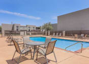 Thumbnail 21 of 54 - our apartments have a pool and patio with chairs and tables