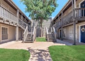 Thumbnail 5 of 54 - our apartments have a spacious courtyard with stairs and grass