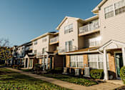 Thumbnail 11 of 35 - a row of houses with a sidewalk in front of them