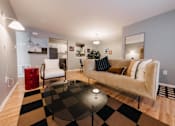 Thumbnail 4 of 35 - a living room with a checkered rug and a couch