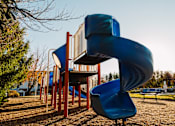 Thumbnail 14 of 35 - a slide at a playground at a park