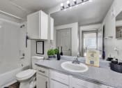 Thumbnail 5 of 14 - a bathroom with a sink and a toilet
