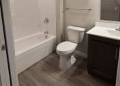 Thumbnail 5 of 27 - a bathroom with a toilet and a tub and a sink
